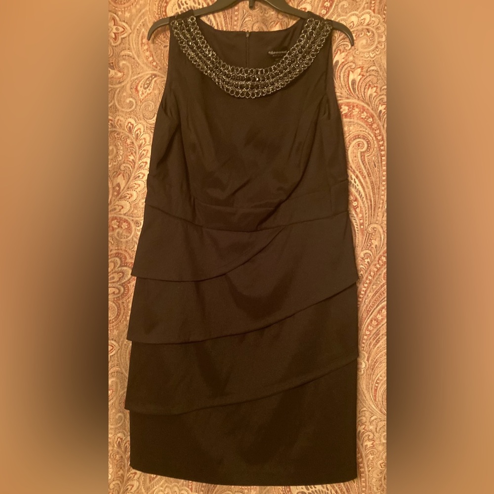 A beautiful black sleeveless dress. Size 14. Classic black dress.